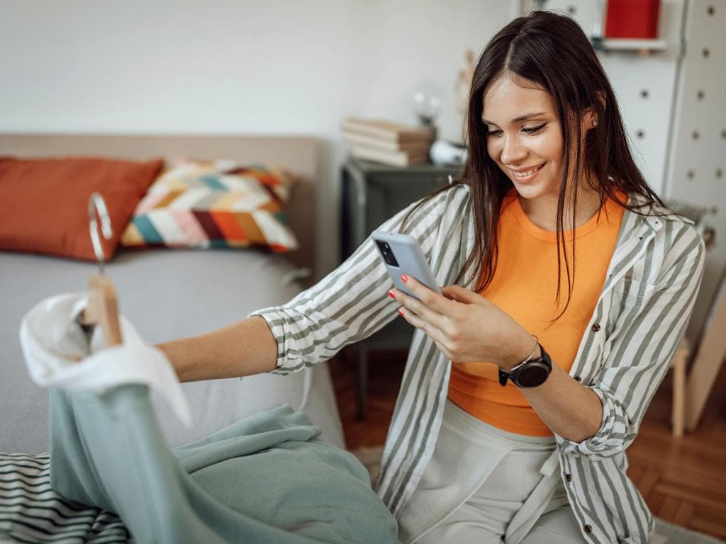 Woman taking a picture of her coat